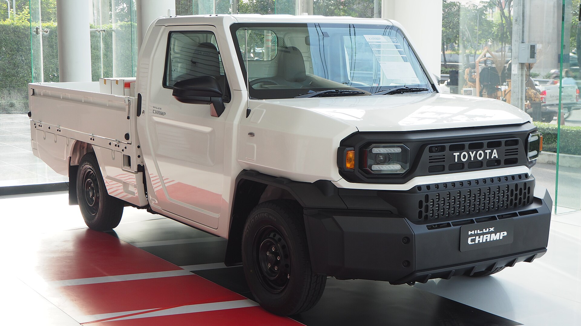 White one-ton Toyota commercial pickup