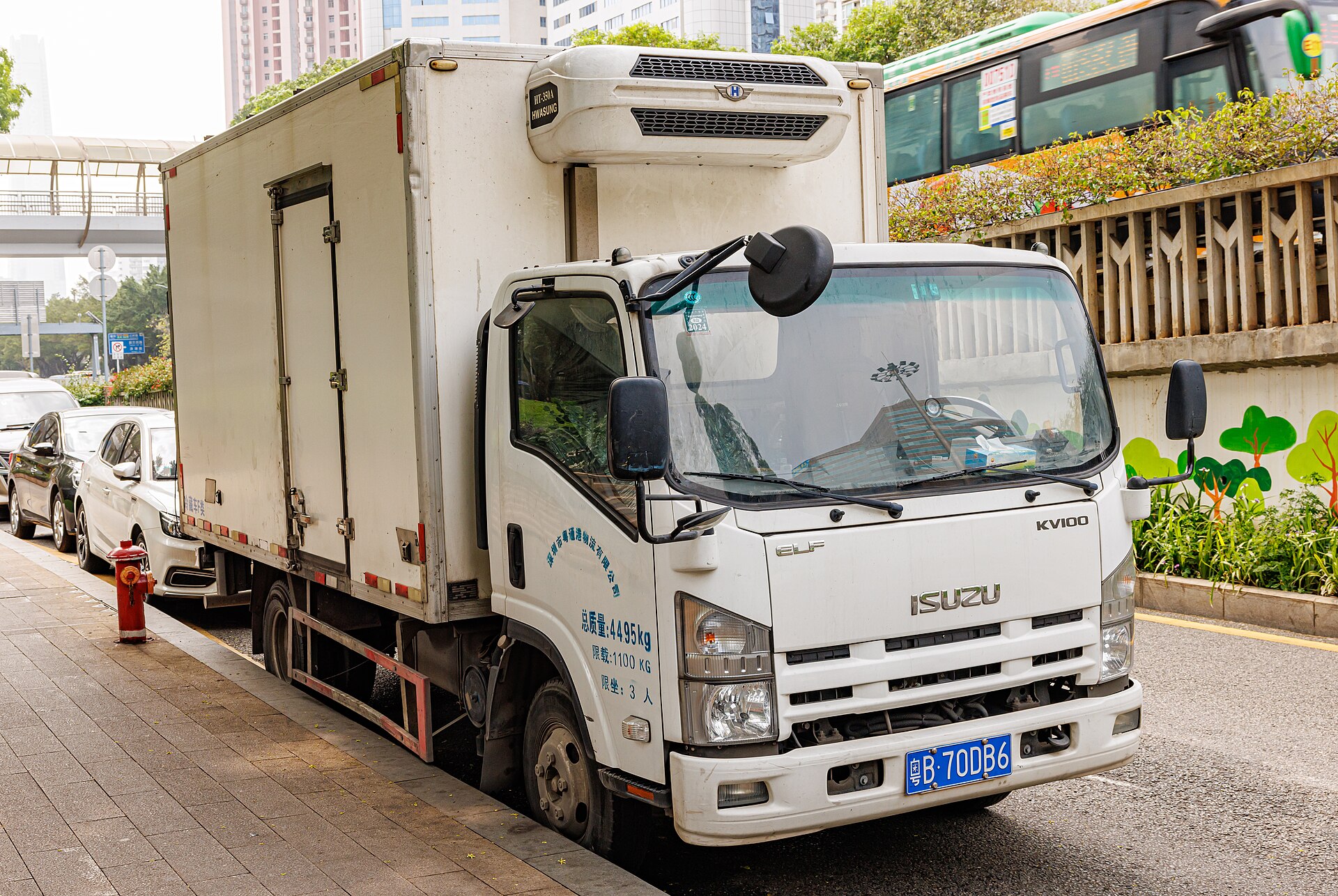 White three-ton Isuzu delivery truck